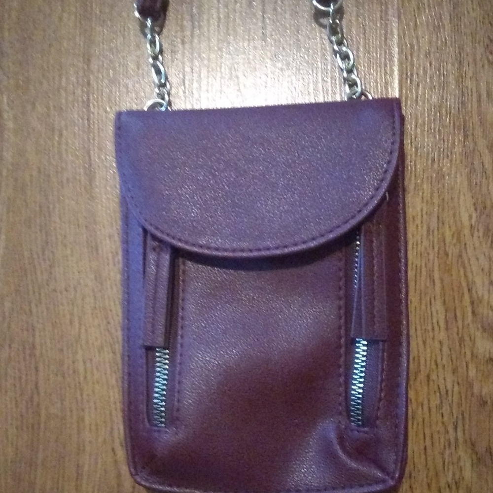 Genuine leather crossbody multi pocket clutch.